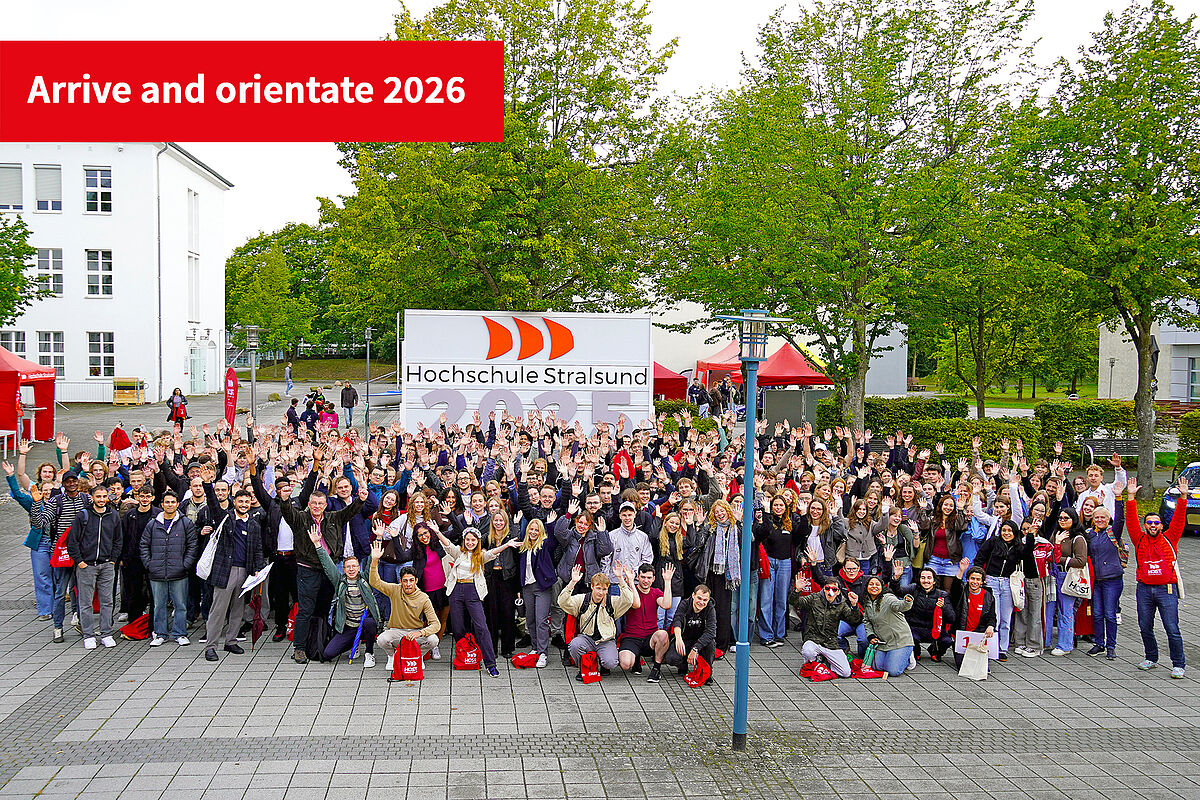 Our first-year students in September 2025 stand in front of the year sign for a group photo